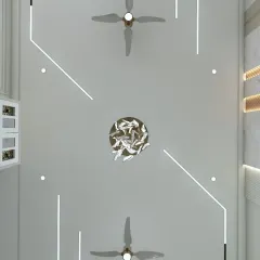 A view of a false ceiling with a unique, abstract lighting design and a sculptural chandelier. This shows how the "fifth wall" can be a work of art.