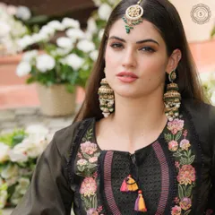 Slay every wedding event with rental jewels that make you glow. This model looks stunning in our antique-finish jhumkas and maang tikka.