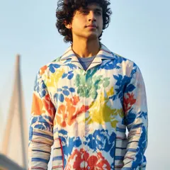 This multi-colored printed linen shirt is a canvas for your spirit. Let your vibrant personality shine through in this statement piece, perfect for summer.