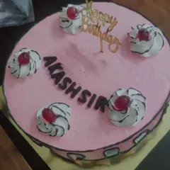 A fun take on a classic cake, this design has a comic book-style outline. The pink frosting and simple piped swirls make it a playful choice for any birthday.