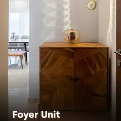 This minimalist foyer unit features a stunning wood cabinet with a geometric parquet pattern. The simple design is elevated by a single pendant light, creating beautiful light and shadow play.