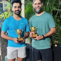 Celebrating the success of our players. These two members showcase their hard-earned trophies after a great performance in a recent tournament.