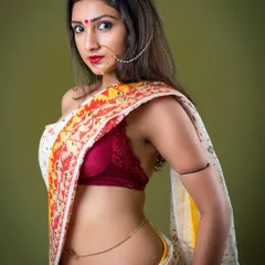 A modern take on traditional wear, this portrait features a woman in a stylishly draped saree against a bold green background. I focused on capturing a sense of liberation and confident femininity.