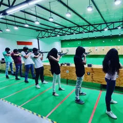 A Sunday session in full swing. You can see the concentration as each person takes aim down the 10-meter range. It's a mental sport as much as a physical one.