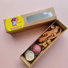 A smaller version of my savoury snack box. It's a great way to sample different treats, including my chicken jerky, a sweet laddoo, and some bite-sized biscuits.