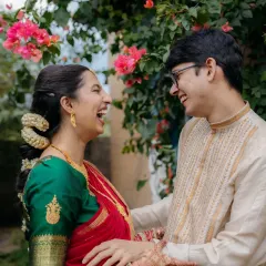 A couple shares a moment of pure, uninhibited laughter. These are the candid, joyful memories that make a wedding day so special.