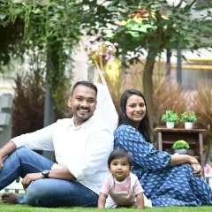 A perfect day for a family portrait outdoors. This session in a beautiful Bangalore park shows how natural light and a relaxed setting can bring out the most genuine smiles and happy moments between parents and their little one.