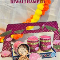 This is one of my premium Diwali hampers, designed to feel both traditional and classy. It features a beautiful lotus-themed tray and contains a selection of my bestsellers like 7-Seeds Nuts Cookies and Toasted Almond Stacks.