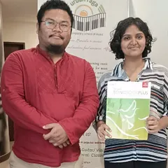 Success at the Rockschool (RSL) grade exams. Our student holds her Songbook Plus, ready to take on her next musical challenge with the guidance of our experienced faculty.
