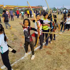 Our youth archery program starts with strong fundamentals. Here, young archers learn discipline and focus using traditional Indian wooden bows during a state competition.