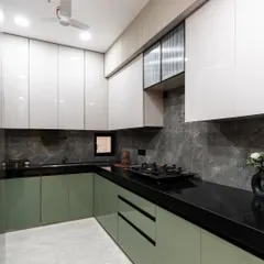 A different angle of our olive green and grey kitchen, showcasing the clean lines and minimal hardware. The design keeps the look cohesive and contemporary, making this kitchen as stylish as it is functional.
