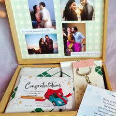 A wife celebrating her husband's new car with a custom hamper. It includes a "Congratulations" card, a personalized letter, and a photo collage of their memories.