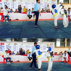 A high-scoring head kick during a competitive match. Our training emphasizes scoring techniques that give our students an edge in tournaments.