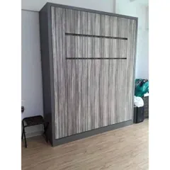 Here is a wall-mounted bed in its closed position. It looks like a sleek, modern cabinet, completely hiding the bed and freeing up the room for other activities.