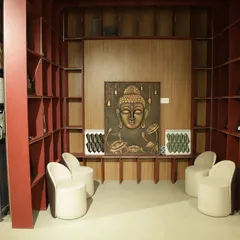 This serene sitting area in my showroom features a custom tile mural of Buddha. It's an example of how I can create a tranquil and spiritual ambiance in a space, using detailed artwork printed on durable tiles to serve as a lasting piece of decor.