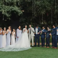 Photographs with friends on your wedding day are a different emotion altogether. Here, we see the fun and camaraderie between the couple and their wedding squad, a memory to be cherished forever.