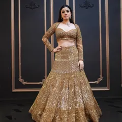 The full look from the golden lehenga shoot. The makeup is designed to be dramatic and eye-catching, perfect for a high-fashion editorial.