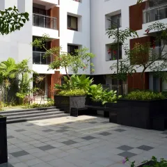 At Sona Vistaas in Bengaluru, I used strategic landscape insertions like these planters and benches to create intimate, shaded seating areas. These spaces enhance the microclimate and encourage casual interactions between neighbors.