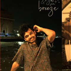 A happy moment by the sea at night, with the city lights and sea breeze as the perfect companions.