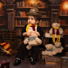 We bring magical worlds to life, like this Harry Potter themed toddler shoot. Our studio is equipped with detailed backdrops, costumes like the sorting hat and scarf, and props to create an authentic and enchanting experience for your little wizard.