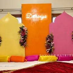 A modern and colorful 'Shaadi ka ghar' setup for a pre-wedding celebration at home. We used bright, arch-shaped panels and a 'Dulhaniya' neon sign to create a fun photo booth area.
