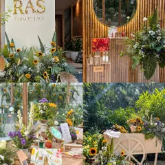 More views from the RAS beauty event, showcasing the product display bar, a branded cart, and seating areas all styled with fresh florals and natural textures for a cohesive brand story.