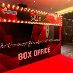 A 'Box Office' themed entrance for a New Year's Eve party at Goregaon Sports Club. This creative entryway, complete with a red carpet and marquee lights, built excitement right from the moment guests arrived.