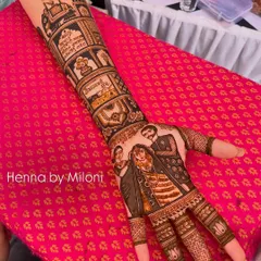 A full story mehendi for a bride. This design includes portraits of the couple, their wedding vows written in Devanagari script, and other personal symbols, telling their unique love story.