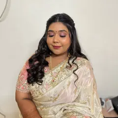 A lovely shot with her eyes closed, showing the soft and beautifully blended eyeshadow work. The pink tones perfectly complement her skin tone and outfit.