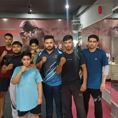 Our self-defense classes are for all ages and fitness levels. Here's a group photo with some of our students, including one of our younger members, ready to learn.