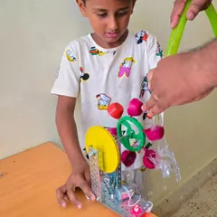 A student explores the power of water and engineering with a water turbine he built. He was so engaged he didn't want the camp to end!