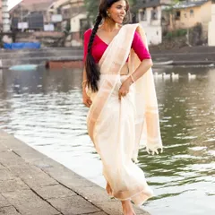 The joy of movement in a traditional saree. I directed this shot to feel candid and natural, capturing a genuine smile as the model connects with the peaceful surroundings.