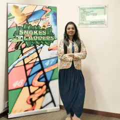 Standing proudly next to the custom Snakes and Ladders setup for the ICICI Venture event. I can help plan and organize all aspects of your event, including unique game stalls and activities.