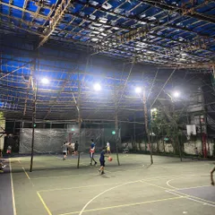A full-court view showing players spread out during a game. This demonstrates the ample space available for a 5-on-5 match, practice drills, or just shooting around.