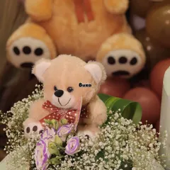 We can "bearly" wait! This teddy bear themed centerpiece, set in a pinewood basket with baby's breath, was the heart of a beautiful baby shower setup I helped create.