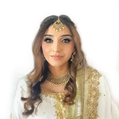 A soft and ethereal look for a wedding guest, perfect for a daytime event or Roka. The makeup is minimal and glowing, paired with a beautiful white and gold embroidered outfit.