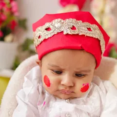 A close-up from our Holi shoot, showing a baby with a little smudge of pink color on his cheek. All colors used are non-toxic and safe for sensitive skin.