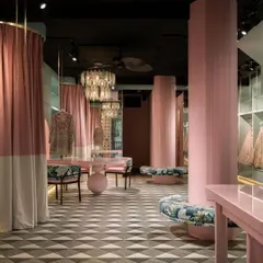 In this fashion studio, we translated the brand's identity into a physical space. The interplay of soft pinks, geometric floors, and custom furniture creates a narrative environment that is both a functional retail area and a living embodiment of the brand's story.