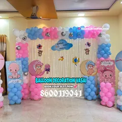 A classic "It's a Boy, It's a Girl" theme using pink and blue balloon pillars and cute baby cutouts. The stork and moon elements add a whimsical touch to this popular baby shower design.