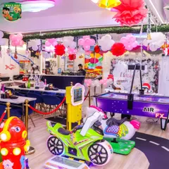 My East Delhi venue is more than just a play area; it's a full entertainment center. Here you can see our air hockey table, arcade games, and fun rides that keep both kids and adults engaged throughout the celebration.