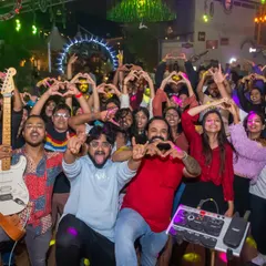 A throwback to our show in Pune, with the whole crowd making heart signs with us. We love our fans, and the feeling is mutual.