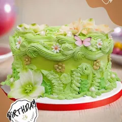 We made Utsavi's birthday wish for a blossoming cake come true. This garden-themed cake, delivered to Jor Bagh, features detailed buttercream foliage, flowers, and a sweet butterfly.