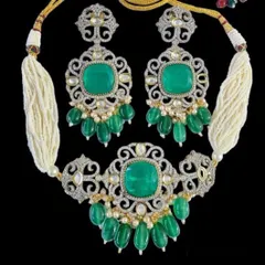 Another view of our Victorian-inspired emerald choker set against a black background to show its brilliant sparkle. This piece is available for both rent and purchase.