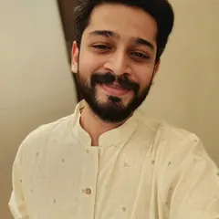A simple and pleasant close-up shot in a light-colored kurta. This type of image works well for brands that want to showcase a natural and relatable look for their men's ethnic collection.