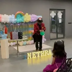 Entertainment is key to a great party. For Nethra's 6th birthday, alongside the rainbow-themed decor, I arranged for a magic show and a tattoo and balloon modelling artist to keep the children engaged.