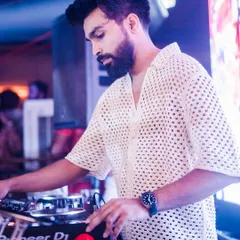 In the zone, mixing tracks at The Fixx Bar. Every transition and beat drop is carefully planned to keep the energy flowing on the dance floor.