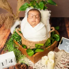 A tiny wizard dreaming of magic. This Harry Potter inspired newborn shoot combines a rustic boho setup with whimsical details for a truly unique portrait.