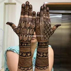 This is for the client who says, "aaj toh paisa vasool karna hai!" A super intricate and heavy traditional design packed with geometric checks, floral bands, and detailed finger work.