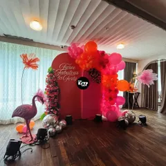 Who says kids get to have all the fun? This 'Fierce, Fabulous & Forty' milestone birthday was all about chic vibes, featuring a bold red backdrop, a tropical flamingo, and a cascade of pink and orange balloons with disco balls.