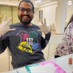 A participant having a great time at our alcohol ink workshop. Our studio is a place for joy and laughter.